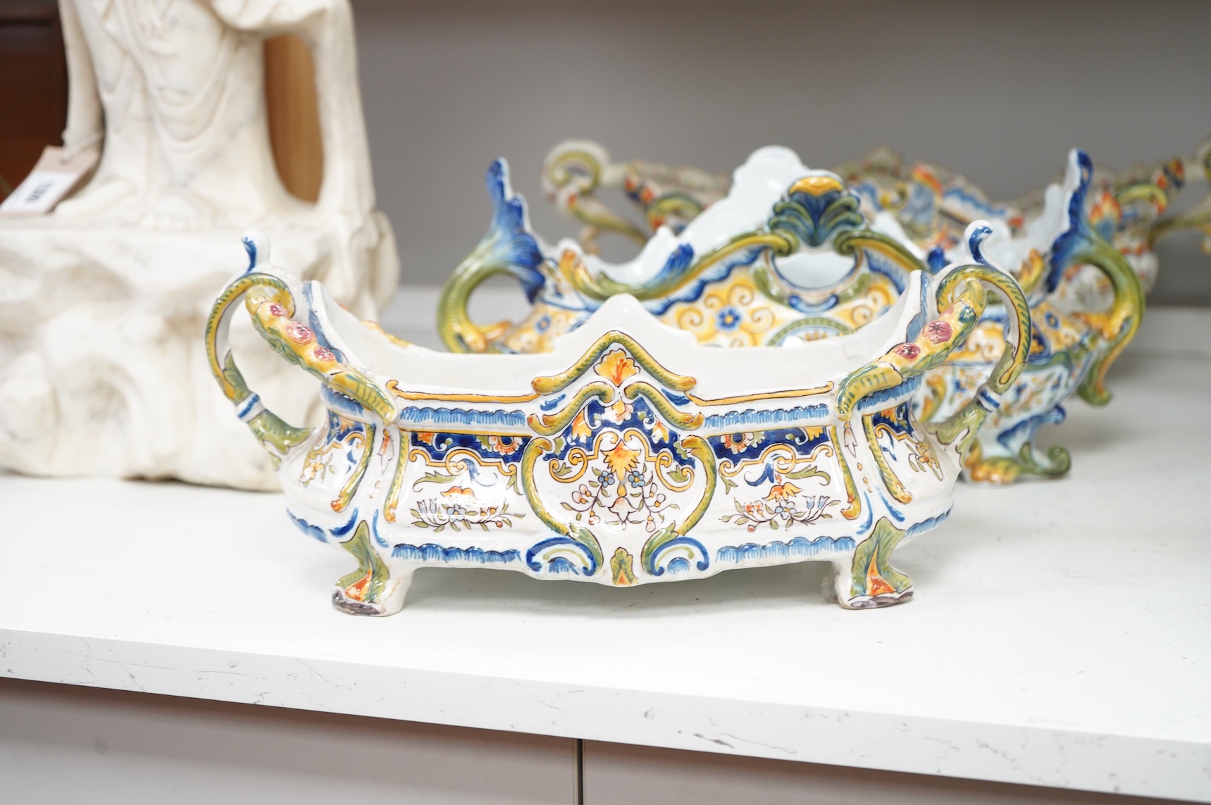 Three French faience planters, one marked Rouen, largest 50cm wide